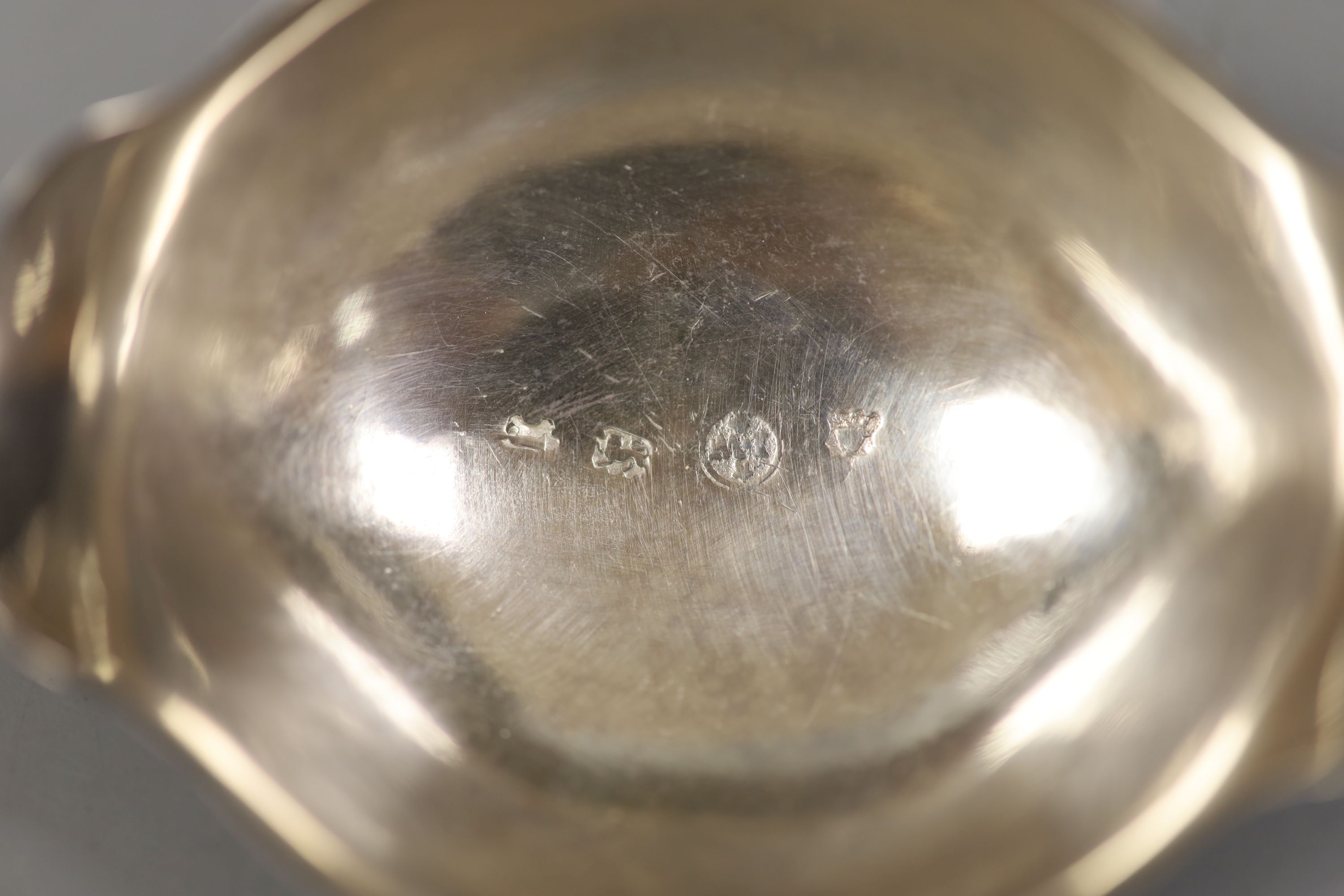 A George II silver toddy ladle with later? turned handle, maker, I.W, London, 1752, 39.4cm.